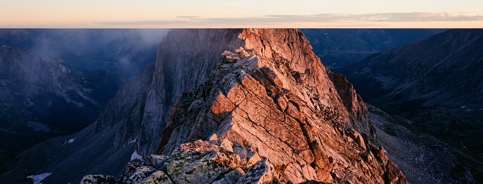 Knife Edge ridge of Capitol Peak at sunrise, narrow exposed ridgeline across the frame