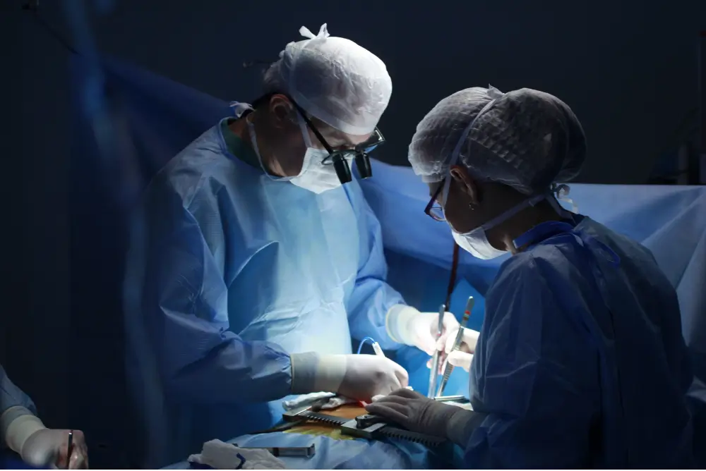 Doctor and assistant performing surgery