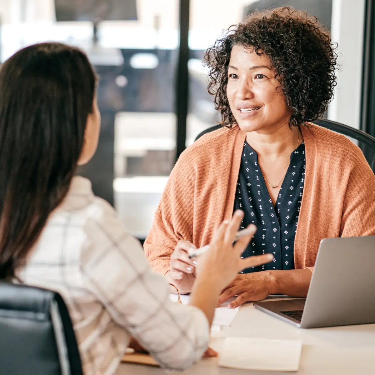Employer with employee discussing employment law