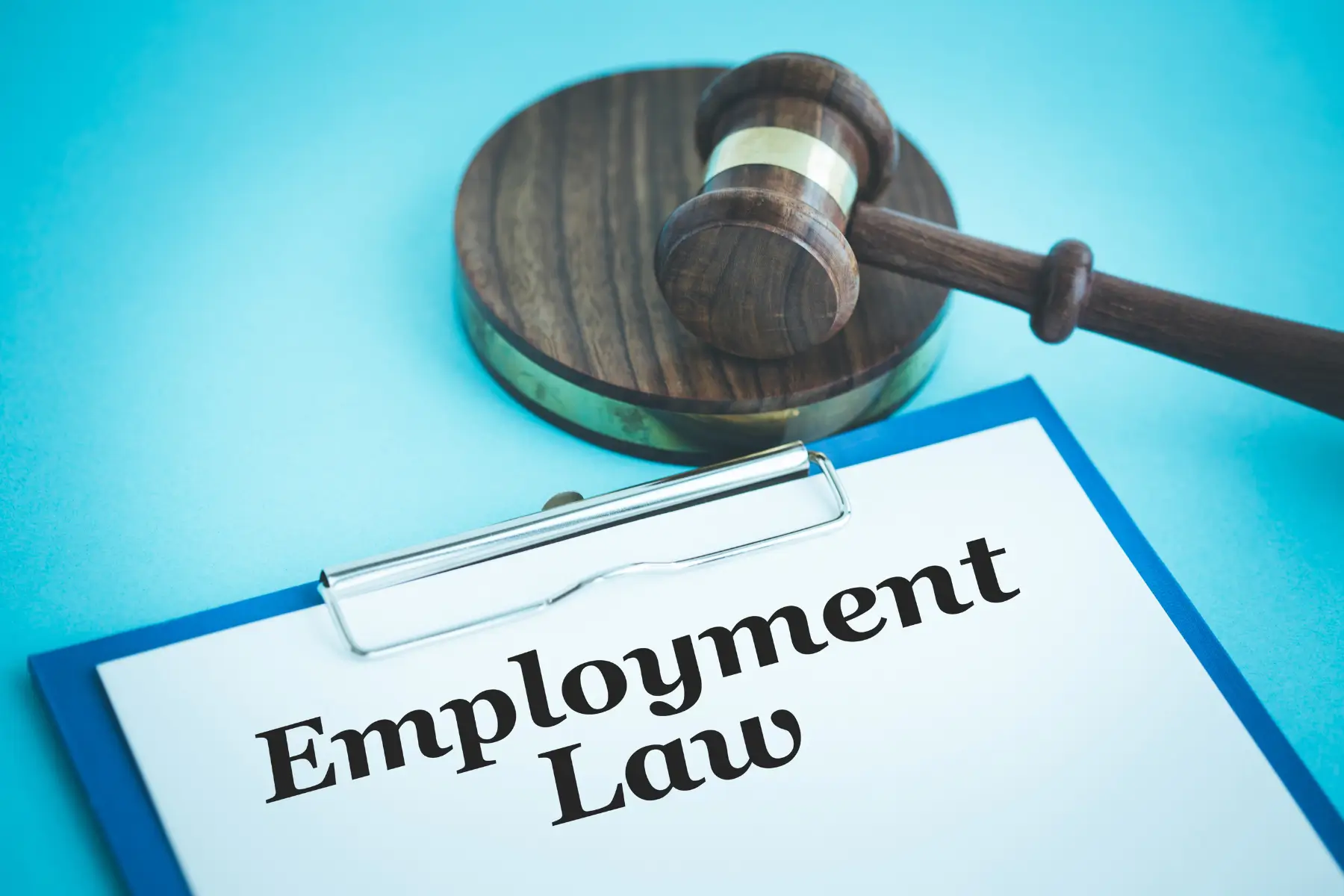 Paper with Employment Law written on it and Gavel