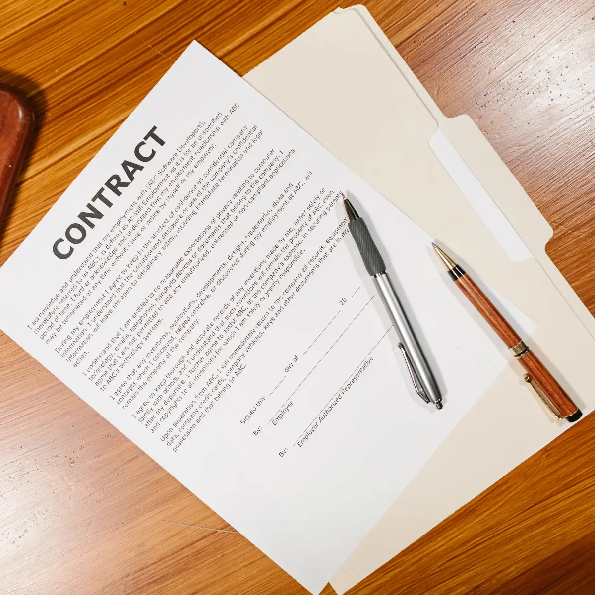 Business contract with pens on top