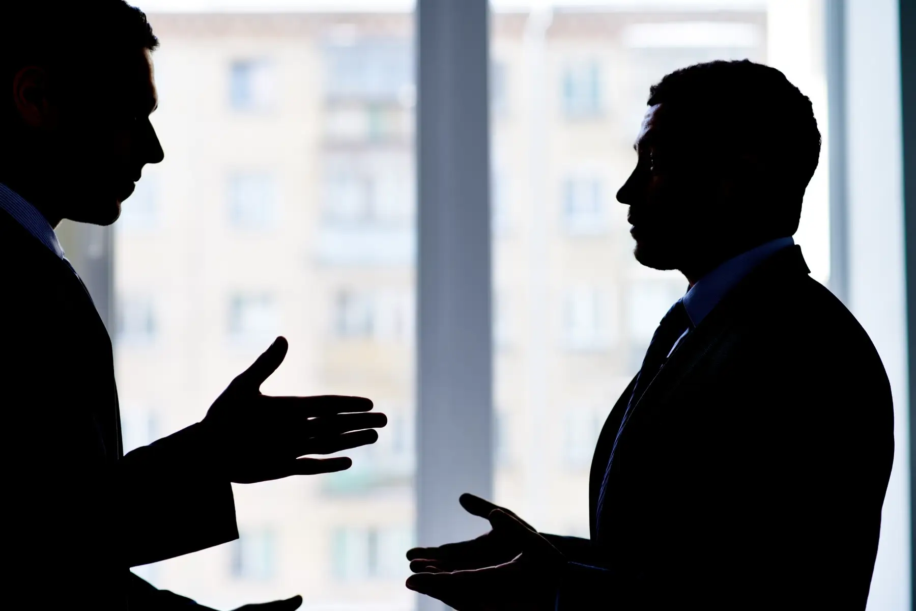 Employer with employee discussing employment law